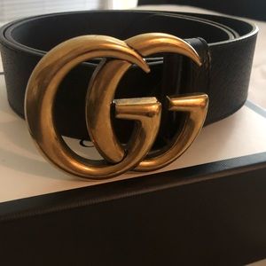 Gucci belt with Double G buckle.